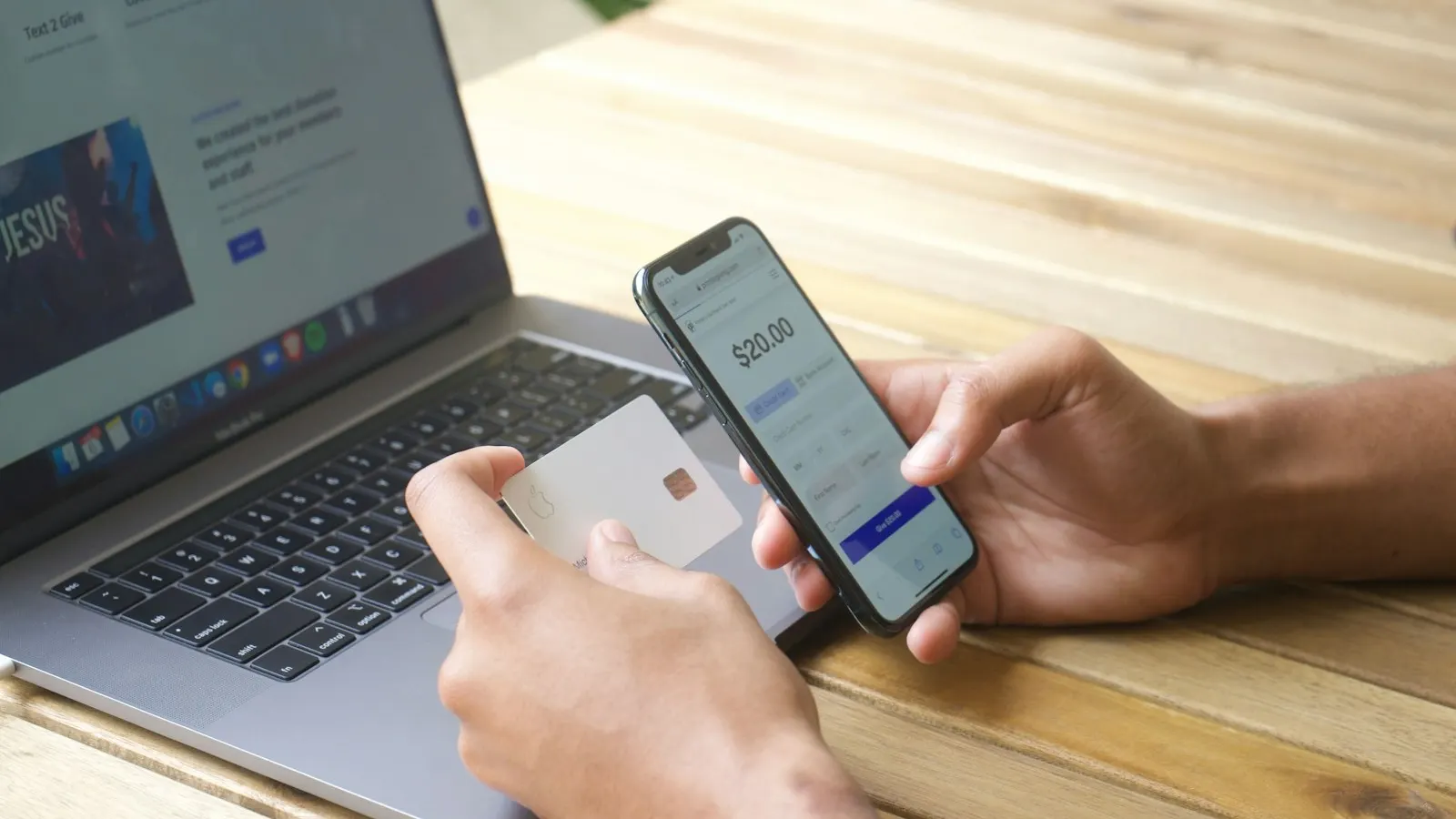 Paying for a travel document online with a card and laptop